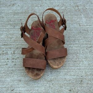 Jelly pop wedges with brown straps.